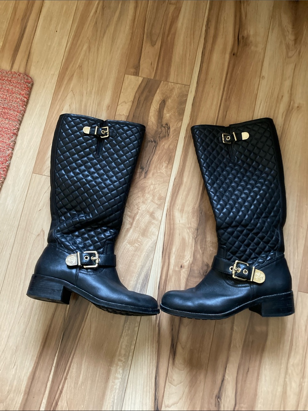 Vince Camuto black leather quilted moto boots with gold tone hardware
